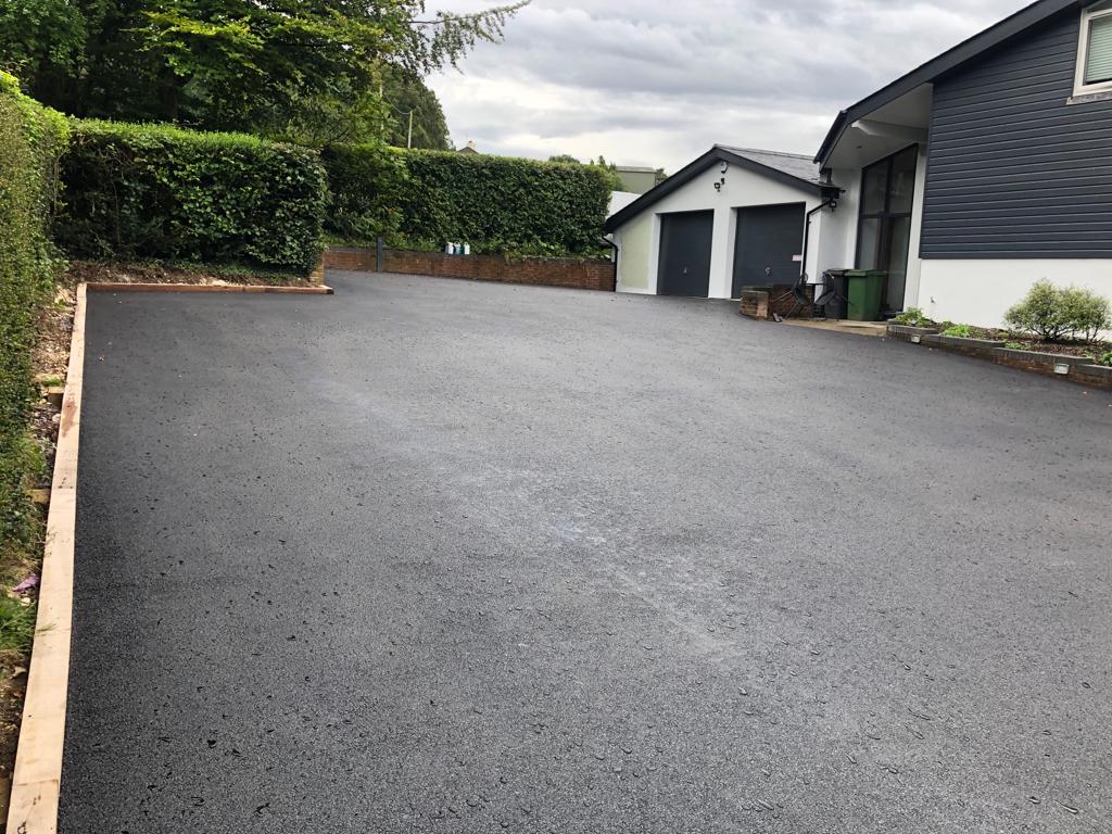 This is a photo of a asphalt driveway which is in the process of being installed by Tenterfield Asphalt & Bitumen Surfacing